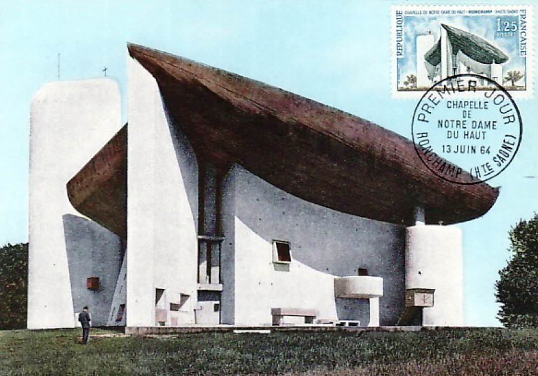 postcard with a coloured photo of the church of ronchamp.
